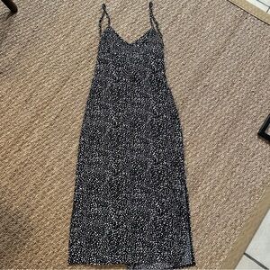 Black and white polka dot dress size 4. dbl slits on sides, tie back & cut out